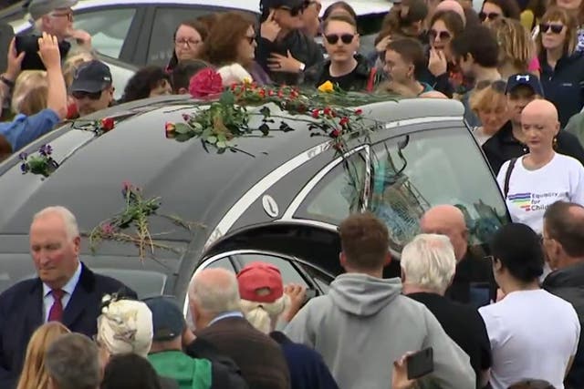 <p>Mourners gather for Sinead O'Connor's funeral procession in Bray. </p>
