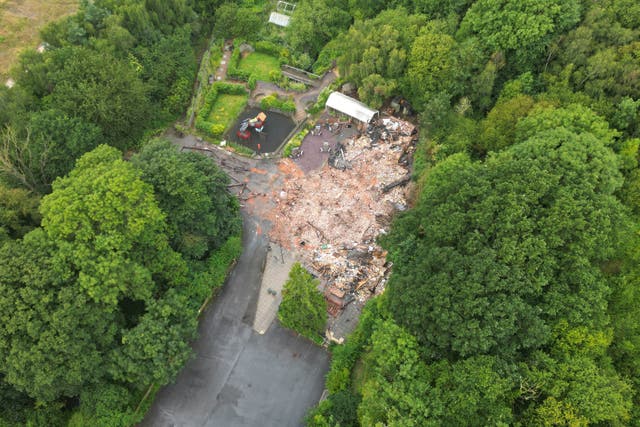 The remains of The Crooked House pub near Dudley which has been demolished two days after it was gutted by fire (David Davies/PA)