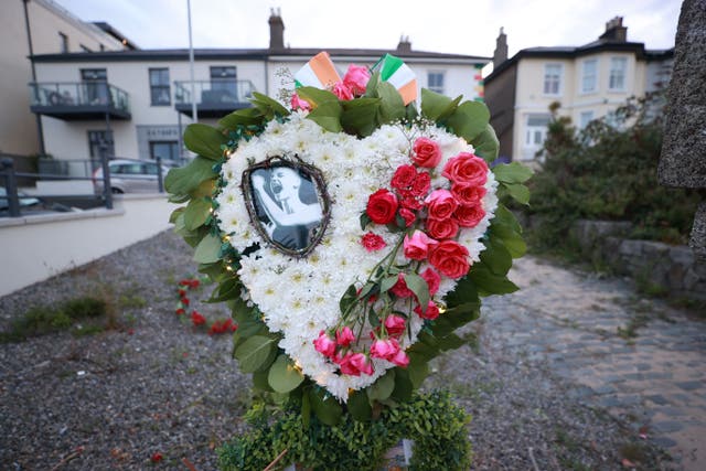 A floral wreath designed by Karen Kehoe, on behalf of victims of abuse in Ireland, placed outside Sinead O’Connor’s former home in Bray, Co Wicklow (Liam McBurney/PA)