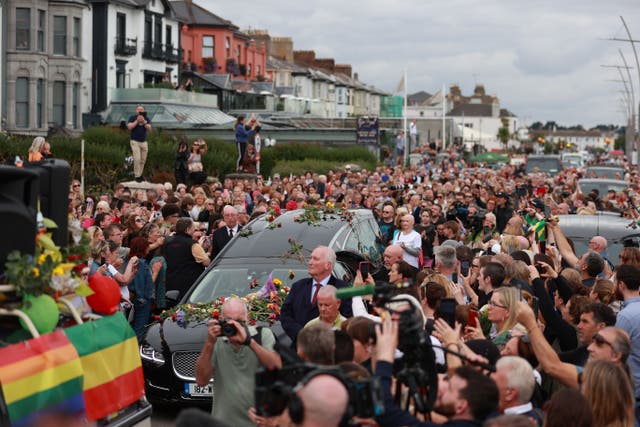 Fans of singer Sinead O’Connor line the streets for a “last goodbye” to the Irish singer as her funeral cortege passes through her former hometown of Bray, Co Wicklow, ahead of a private burial service. Picture date: Tuesday August 8, 2023.