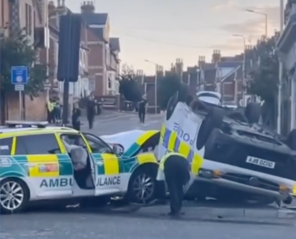 Officers injured as police van flips in crash with ambulance Officers injured as police van flips in crash with ambulance