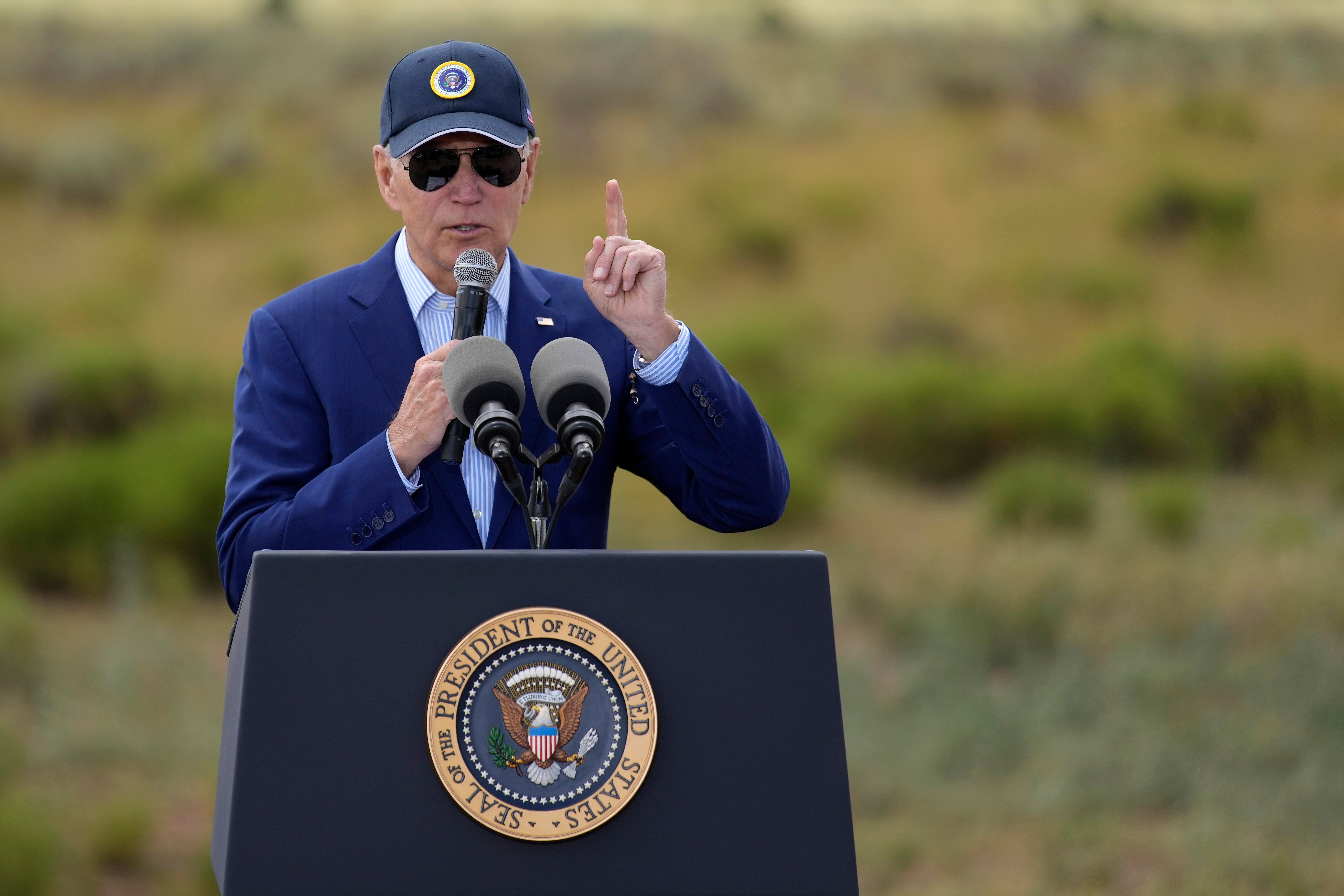 President Joe Biden speaks before signing a proclamation designating the Baaj Nwaavjo I'Tah Kukveni National Monument at the Red Butte Airfield Tuesday, Aug. 8, 2023, in Tusayan, Ariz. (AP Photo/John Locher)