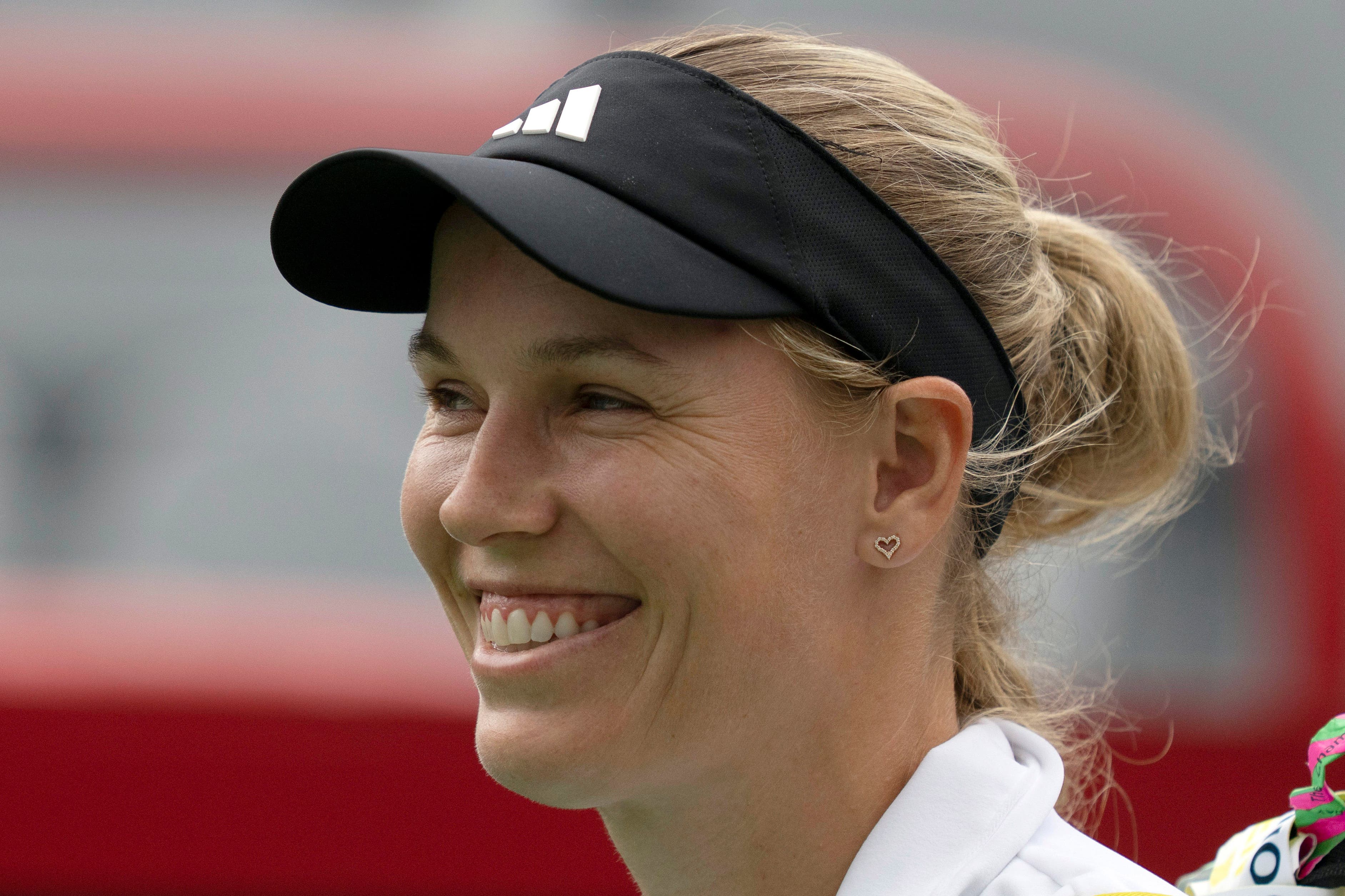 Caroline Wozniacki won on her competitive return to tennis in Montreal (Christinne Muschi/AP)