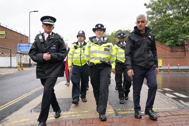 Metropolitan Police Commissioner Sir Mark Rowley, Constable Emily Waite and mayor of London Sadiq Khan at the launch of a mobile phone robbery intervention initiative (Jonathan Brady/PA)
