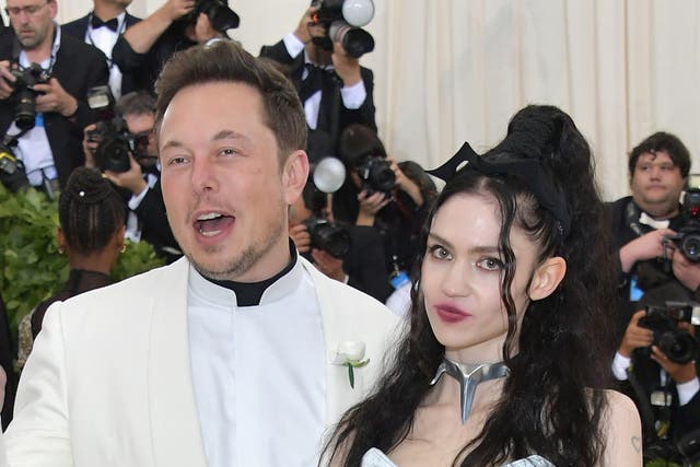 <p>Elon Musk with his former partner Grimes  </p>