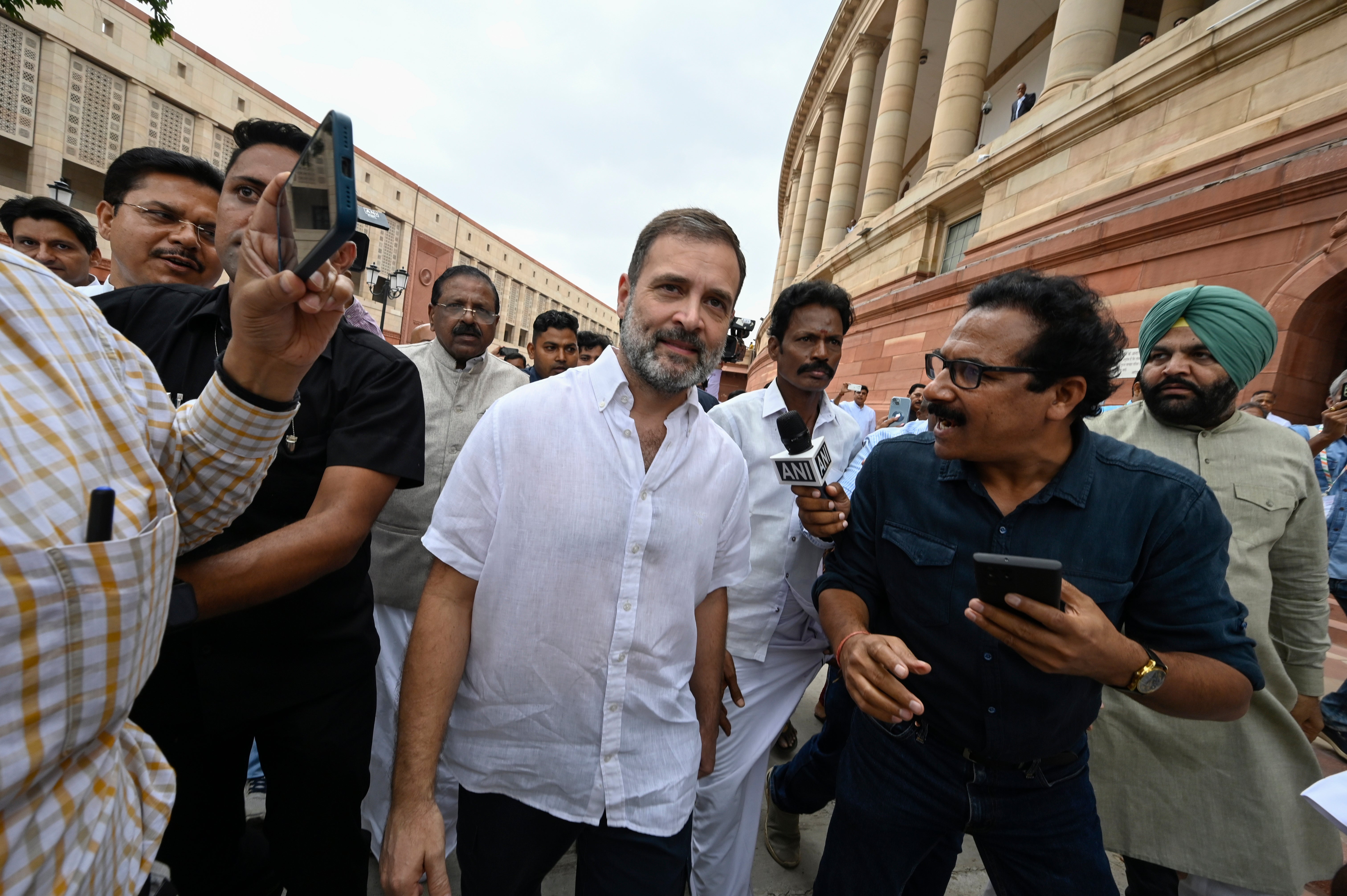 Rahul Gandhi arrives at the Parliament House after he was reinstated as an MP.