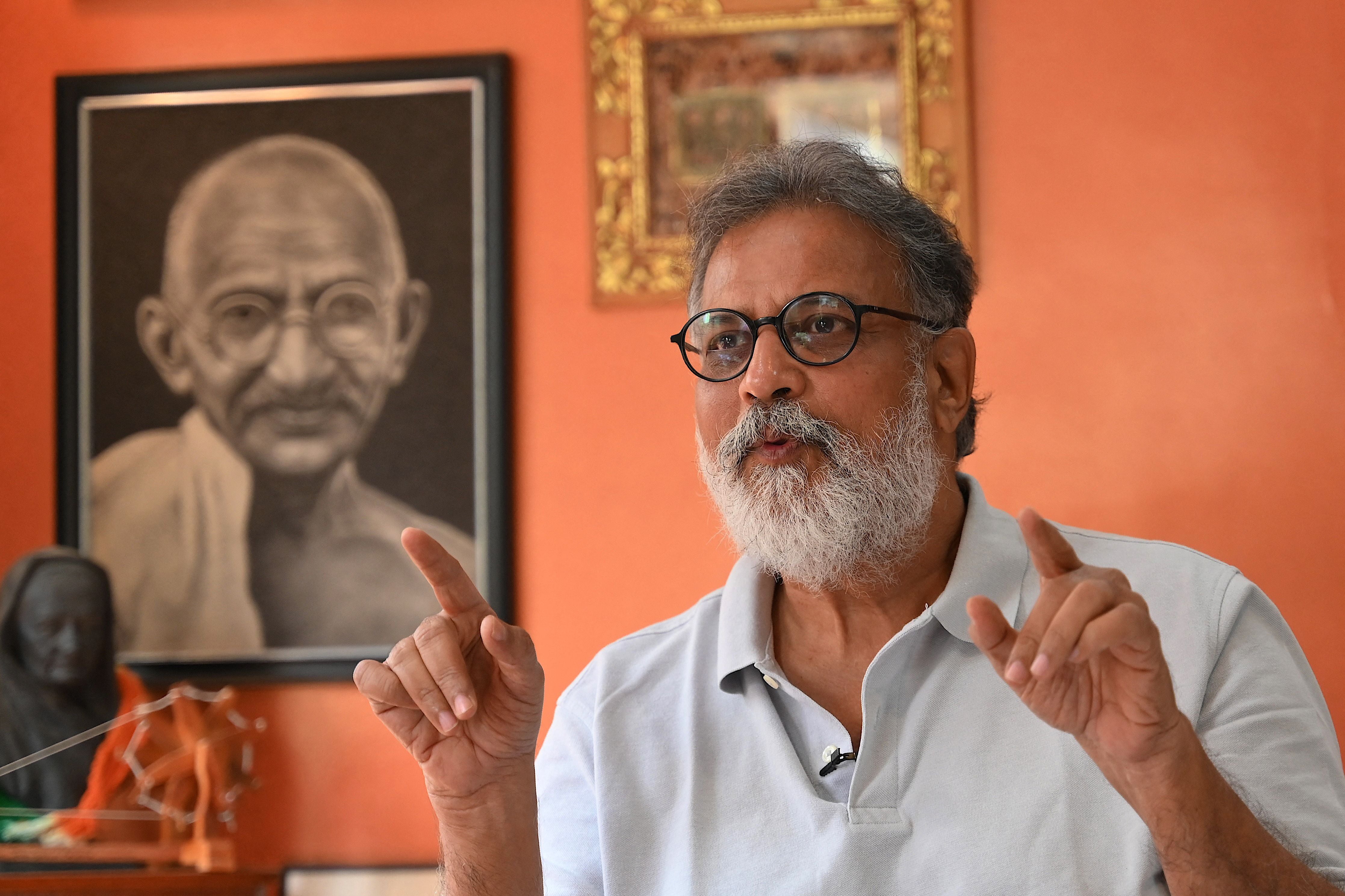 Indian author Tushar Gandhi, who is the great-grandson of Mahatma Gandhi, speaks during an interview at his home in Mumbai