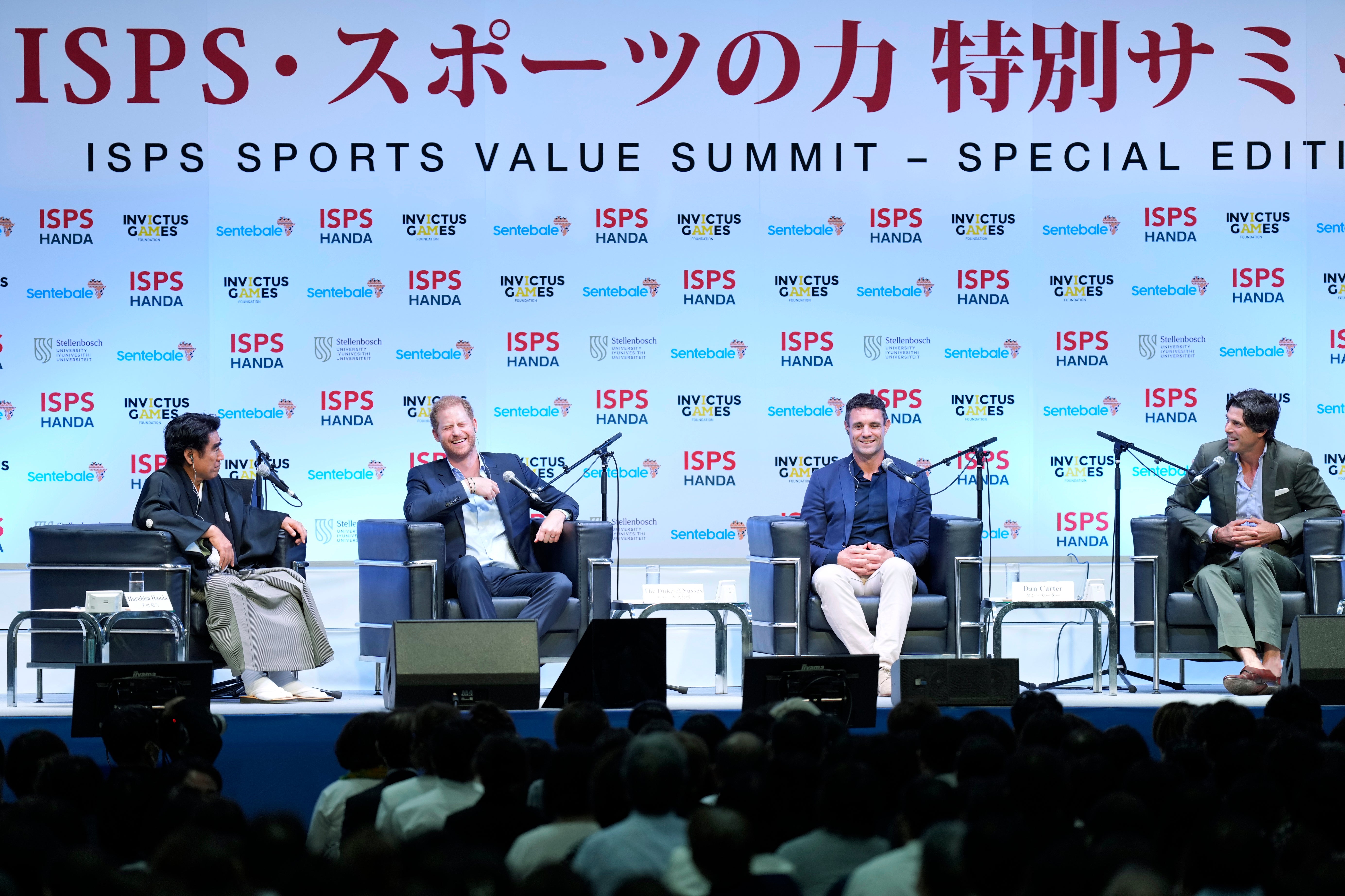 Haruhisa Handa, from left, CEO of the International Sports Promotion Society (ISPS), Britain's Prince Harry, former All Blacks player Dan Carter and Argentine polo player Ignacio "Nacho" Figueras attend an event organized by the ISPS Wednesday, Aug. 9, 2023