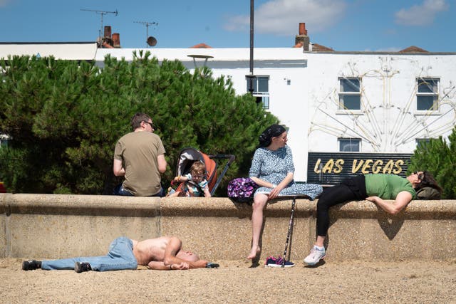 <p>Beachgoers enjoy the warmer weather in Southend-on-Sea</p>