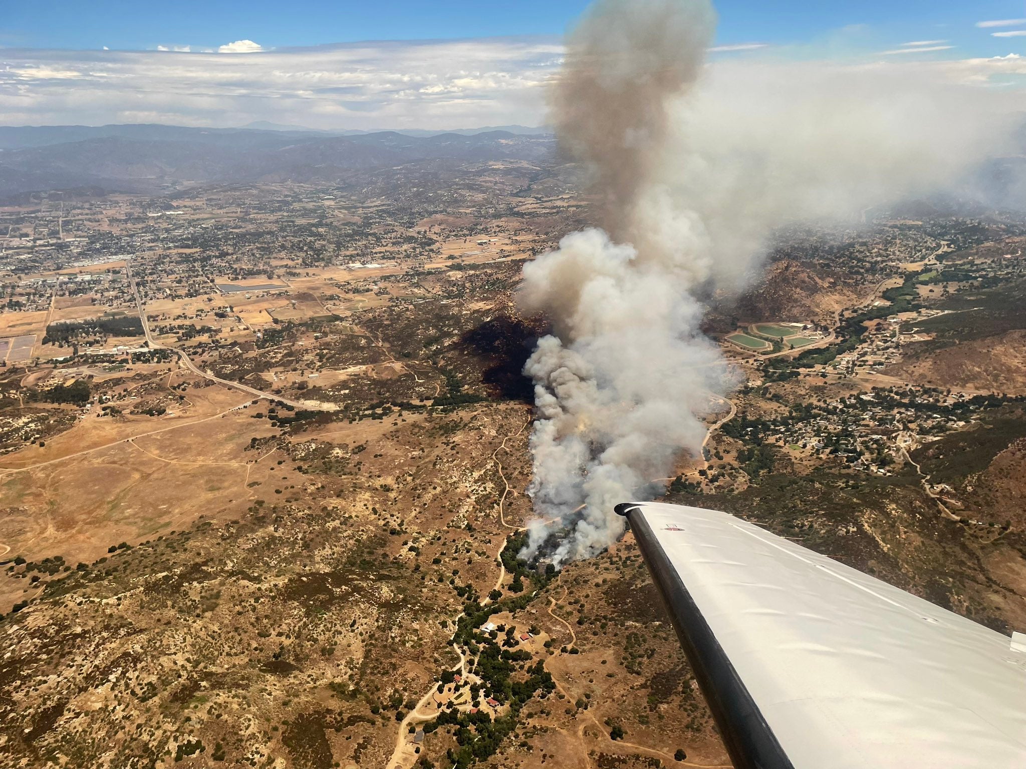 The Bunnie Fire near Ramona, California, is seen from the air on 9 August, 2023