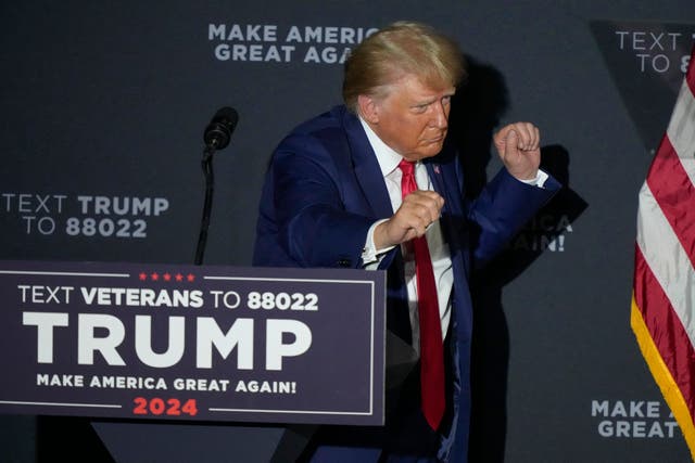 <p>Former President Donald Trump dancing at a campaign rally </p>