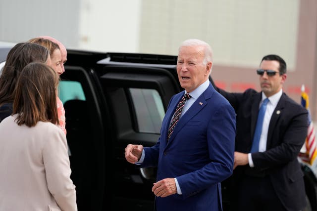 <p>File photo of Joe Biden talking with greeters after he arrives on Air Force One upon arrival at Roland R Wright International Guard Base on 9 August</p>