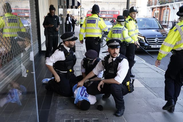 <p>Police officers made nine arrests after hundreds of youths descended on Oxford Street</p>