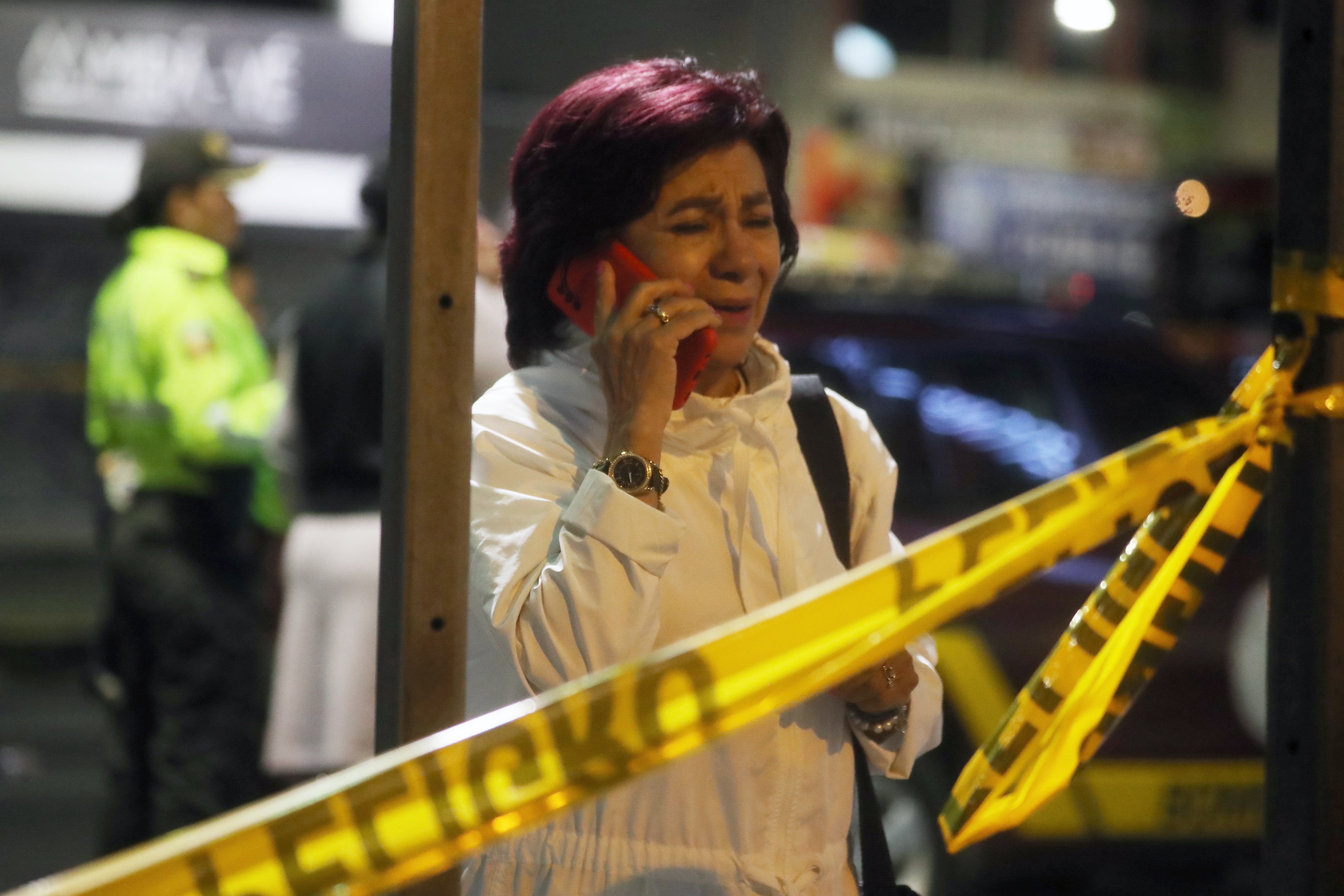 A supporter of Ecuadorian presidential candidate Fernando Villavicencio outside the clinic where the politician was killed