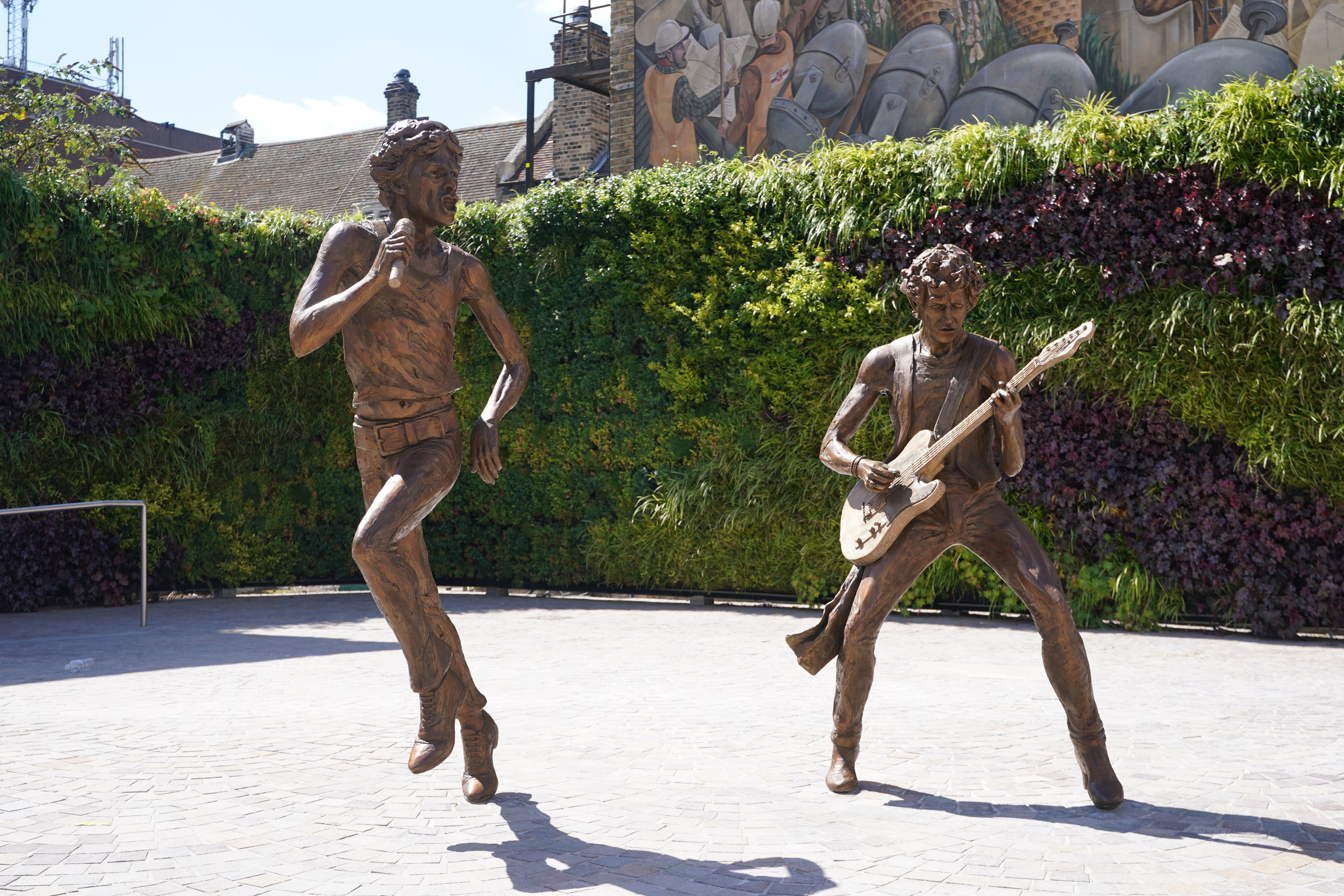 <p>A general view of “The Glimmer Twins”, a statue of Rolling Stones Sir Mick Jagger and Keith Richards created by sculptor Amy Goodman, during its unveiling at One Bell Corner in Dartford, Essex. </p>