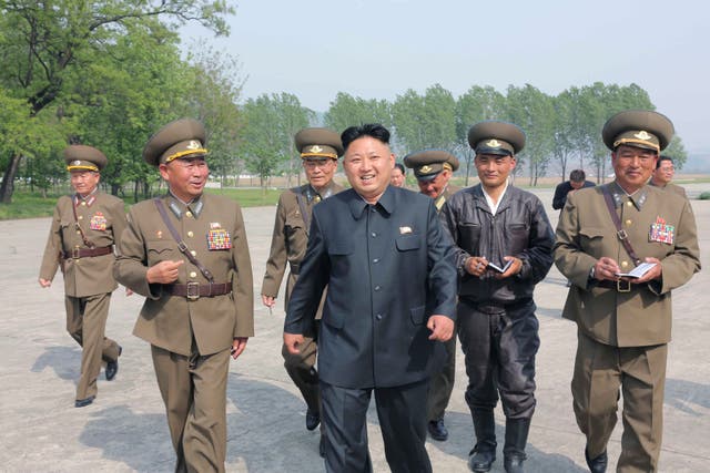 <p>North Korean leader Kim Jong-un walks with officials during an inspection of the Korean People's Army (KPA) Air and Anti-Air Force Unit 447</p>