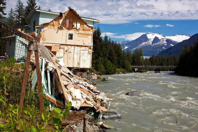 <p>Debris from a home that partially fell into the Mendenhall River</p>