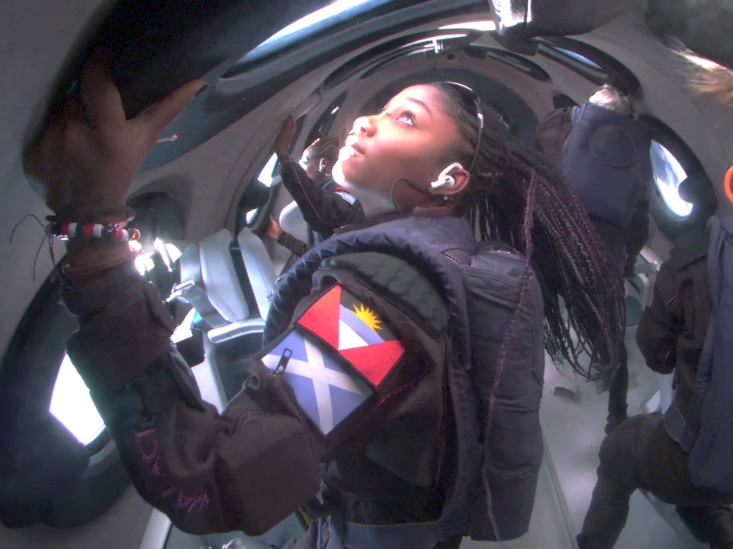 Anastatia Mayers and her mother Keisha Schahaff gaze back at Earth from the ISS Voyager