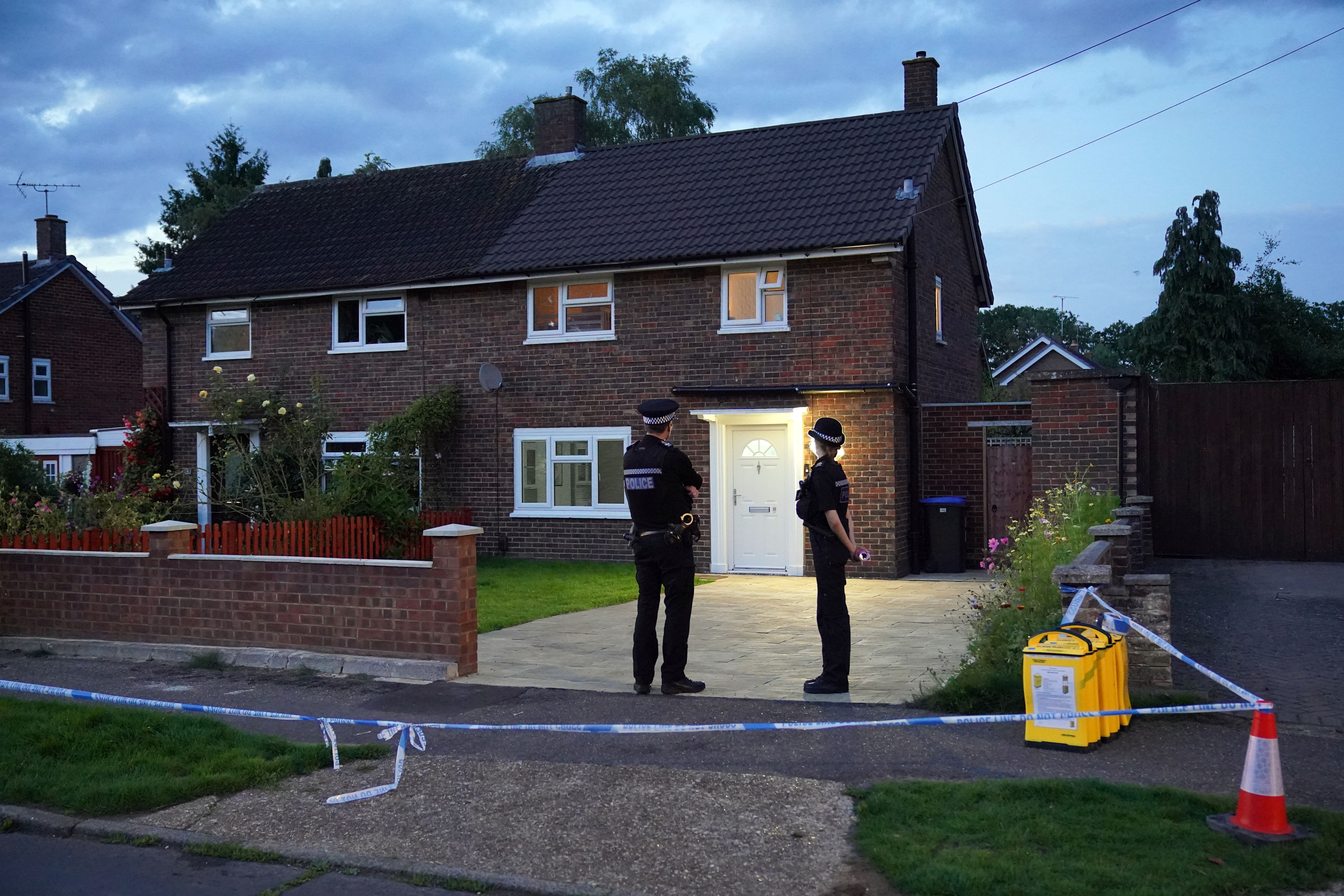 Police outside a property on Hammond Road in Woking, Surrey, after a 10-year-old girl was found dead (Jonathan Brady/PA)