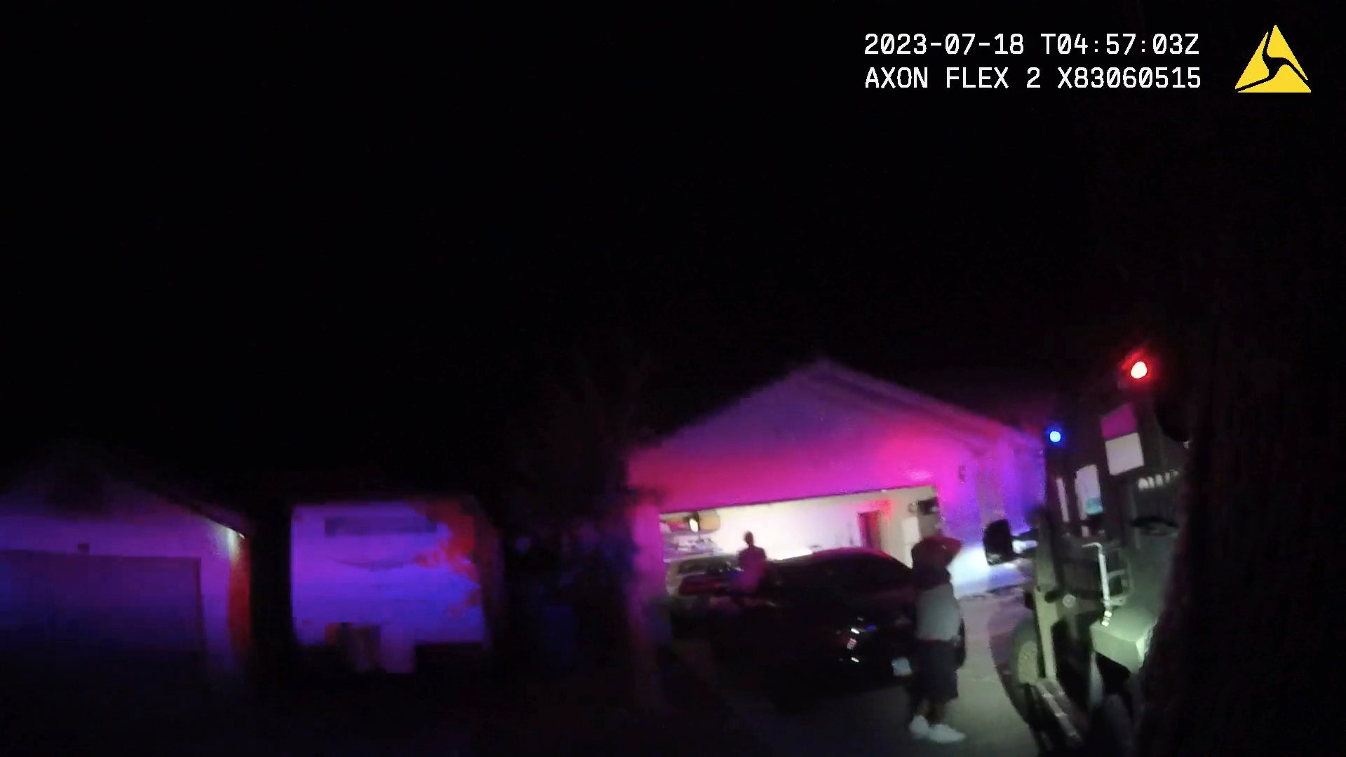 In this Monday evening, July 17, 2023 image taken from police body camera video provided by the Las Vegas Metropolitan Police Department, an unidentified man and woman are seen as SWAT officers raided a home in the nearby city of Henderson, Nev., in connection with the 1997 killing of rapper Tupac Shakur near the Las Vegas Strip.