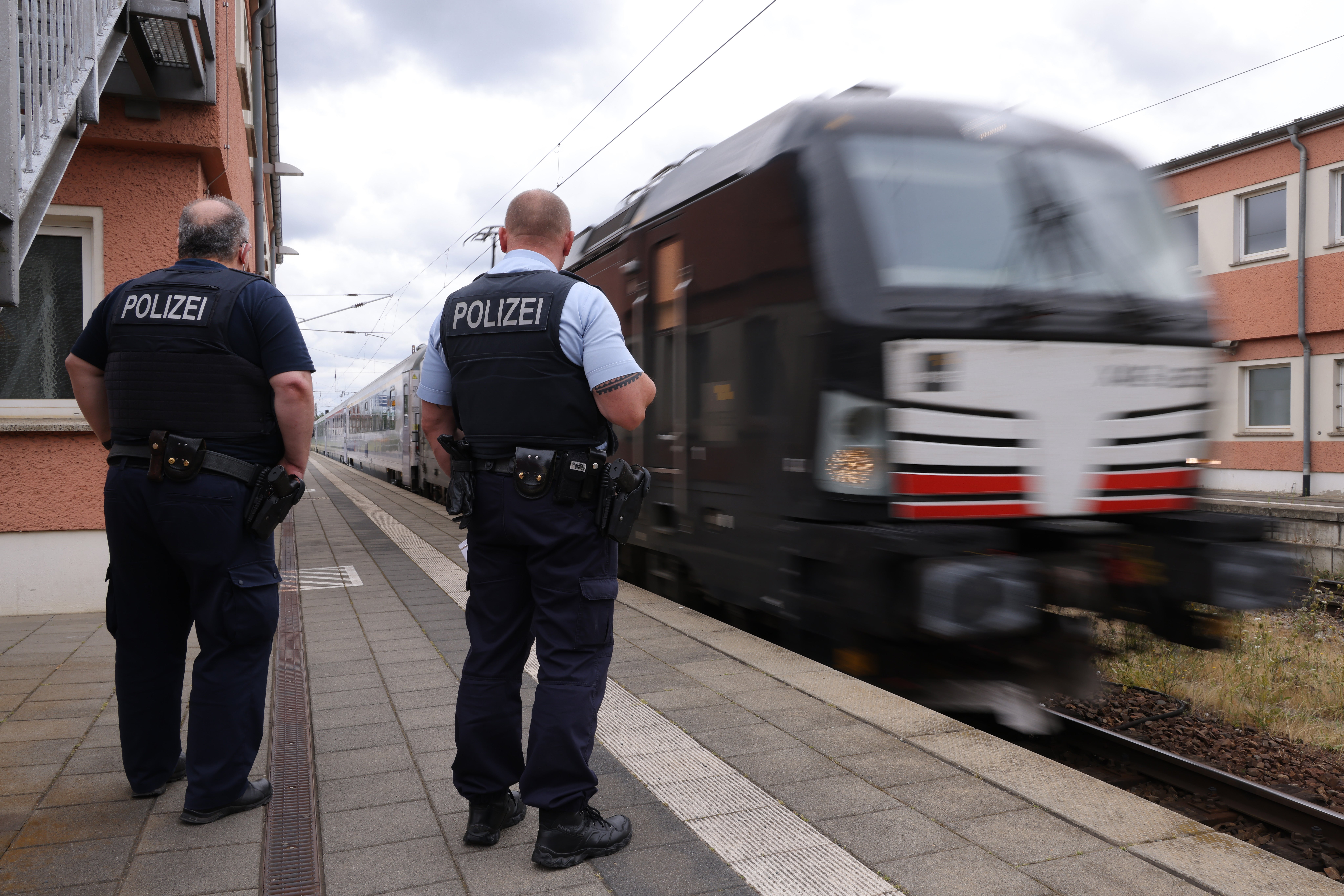 Members of Germany's federal police (Bundespolizei) prepare to board a train arriving from Warsaw