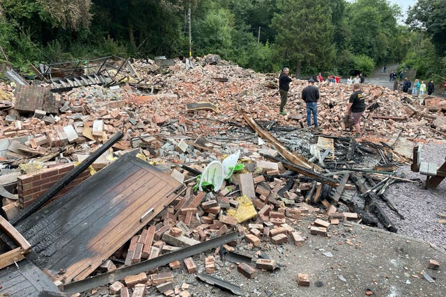 What was left of the Crooked House pub was demolished on Monday (Matthew Cooper/PA)