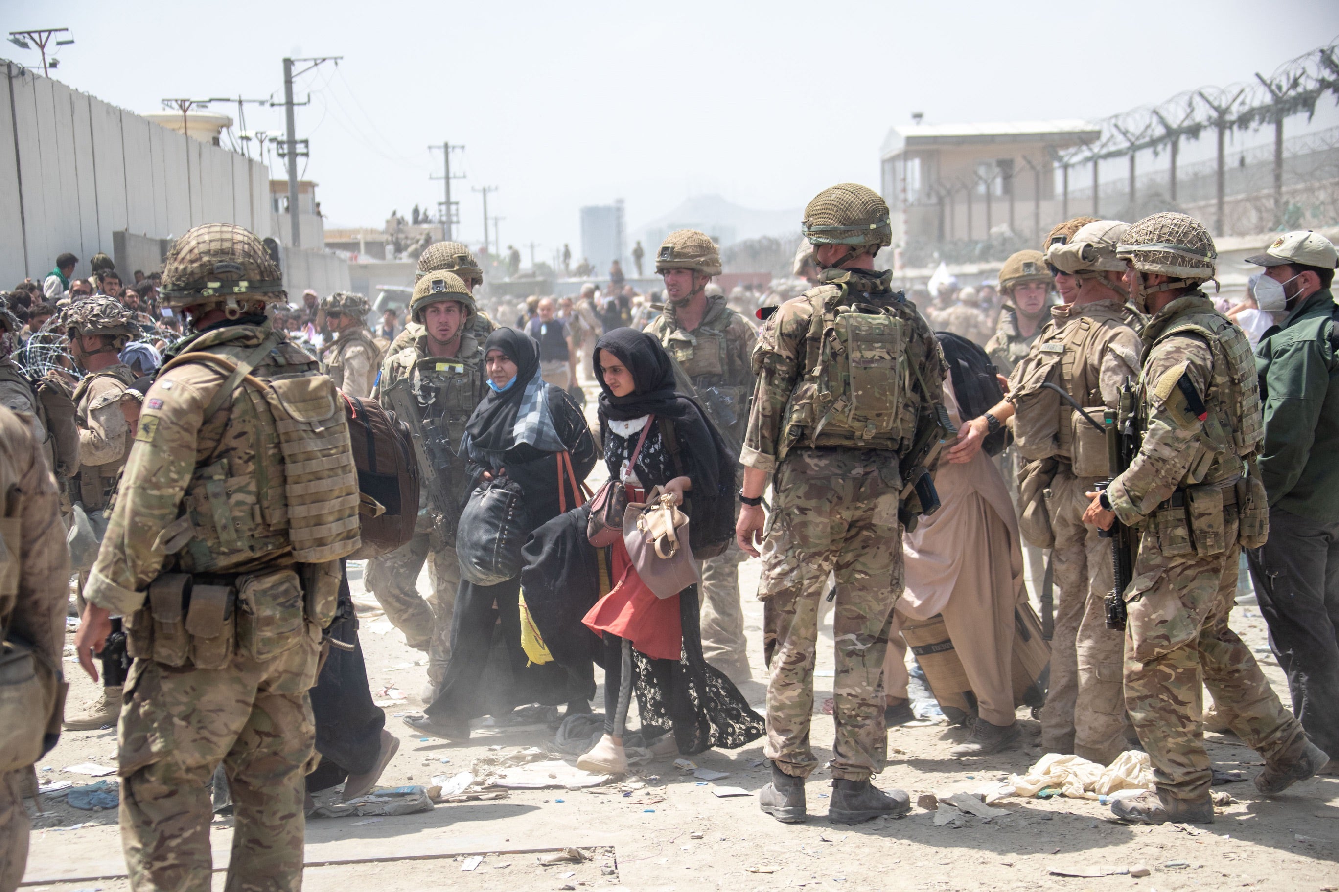 British armed forces in Kabul work with the US military to evacuate eligible civilians and their families out of the country in August 2021