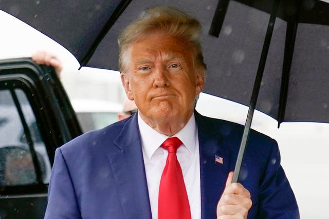 Former President Donald Trump walks to speak with reporters before boarding his plane at Ronald Reagan Washington National Airport, Aug. 3, 2023, in Arlington, Virginia