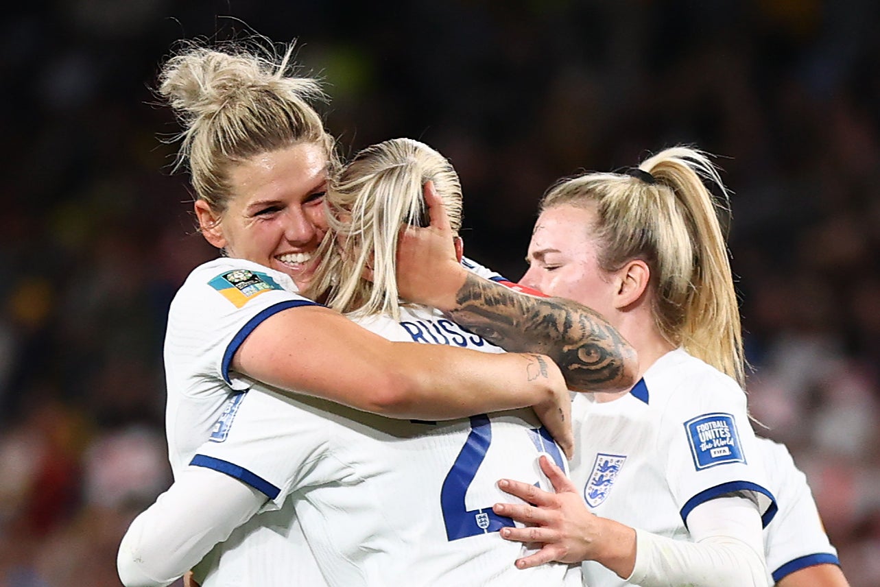 Alessia Russo of England celebrates with teammates Millie Bright and Lauren Hemp