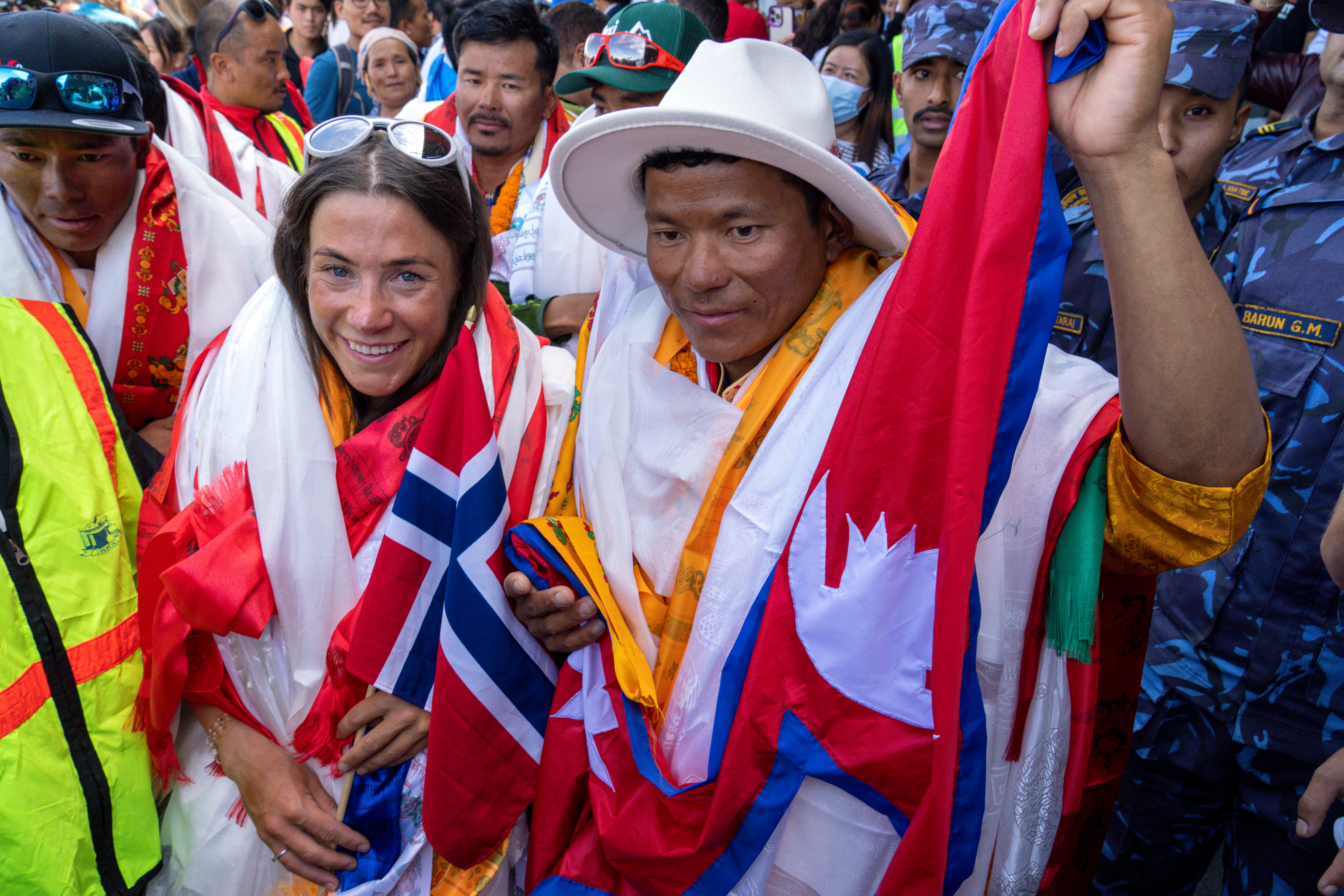 Norwegian climber Kristin Harila, left, and her Nepali sherpa guide Tenjen Sherpa, right, who climbed the world's 14 tallest mountains in record time