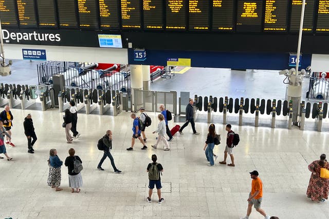 <p>Waiting game: Passengers at the UK’s busiest rail station, London Waterloo, on 12 August 2023 – the last day of the latest overtime ban by members of the train drivers’ union, Aslef</p>