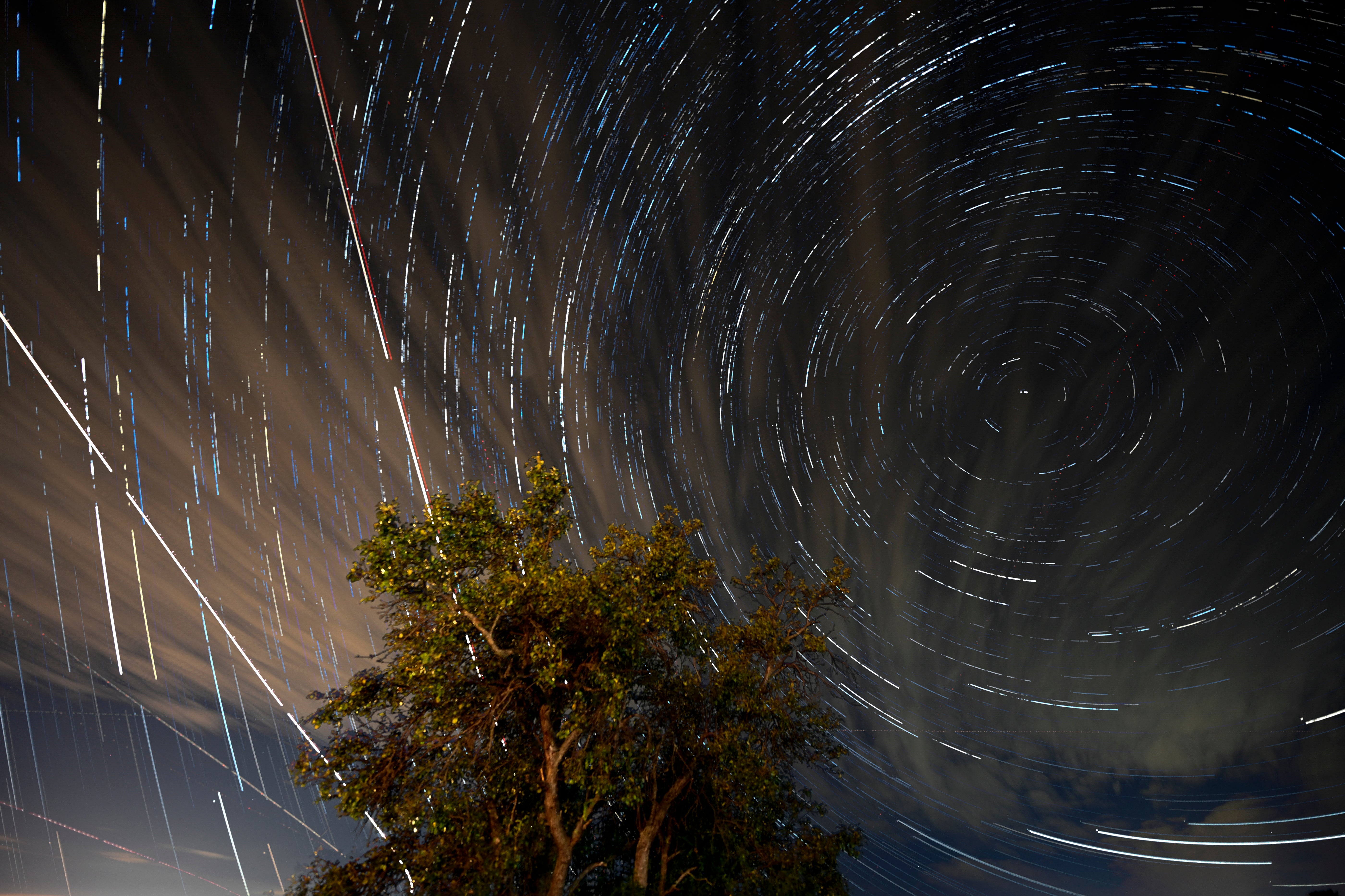 Three hundred and twenty stacked digital images of long exposures show Perseid meteors and airplanes crossing the sky near the city of Kumanovo, Republic of North Macedonia, early 12 August 2023