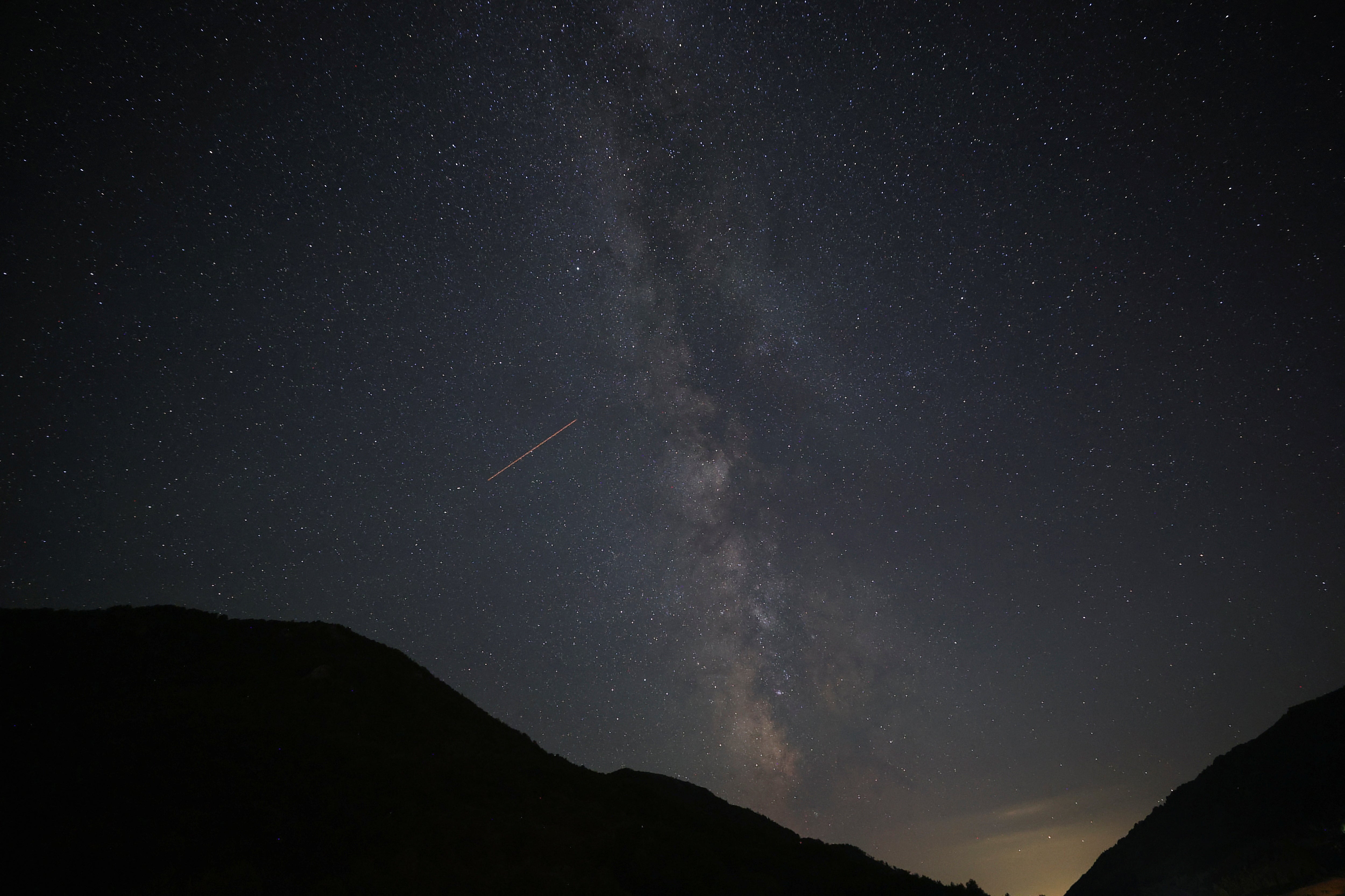 A view of meteor streaks in the night sky during annual Perseid meteor shower at Shebenik National Park, in Fushe Stude, Albania, 13 August 2023
