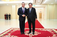 China's foreign minister visits Cambodia days after incumbent premier hands off the job to his son
