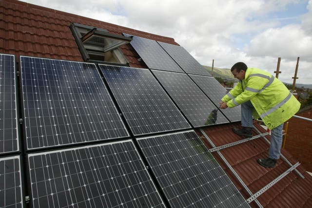 <p>Solar panel installations have surpassed the previous record set in 2012 (Niall Carson/PA)</p>