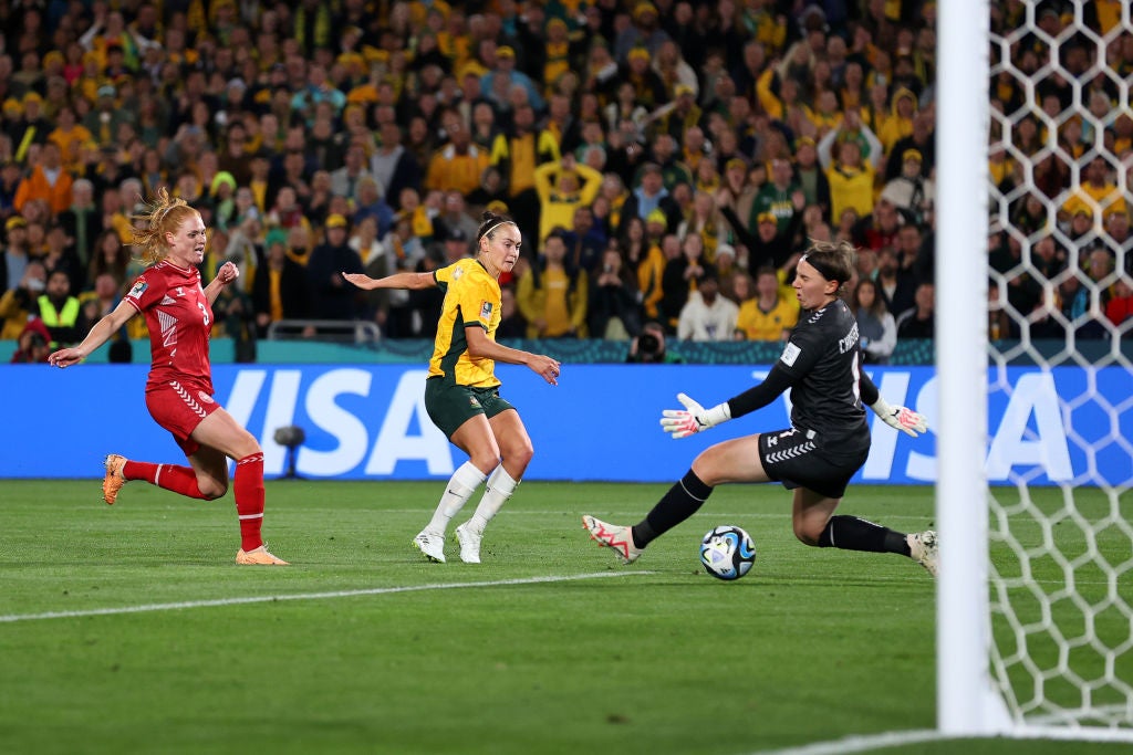 Australia’s Caitlin Foord scores the opening goal in the last-16 win over Denmark