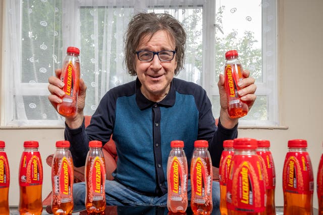 <p>Garry Johnson is addicted to Lucozade and gets through eight bottles a day</p>