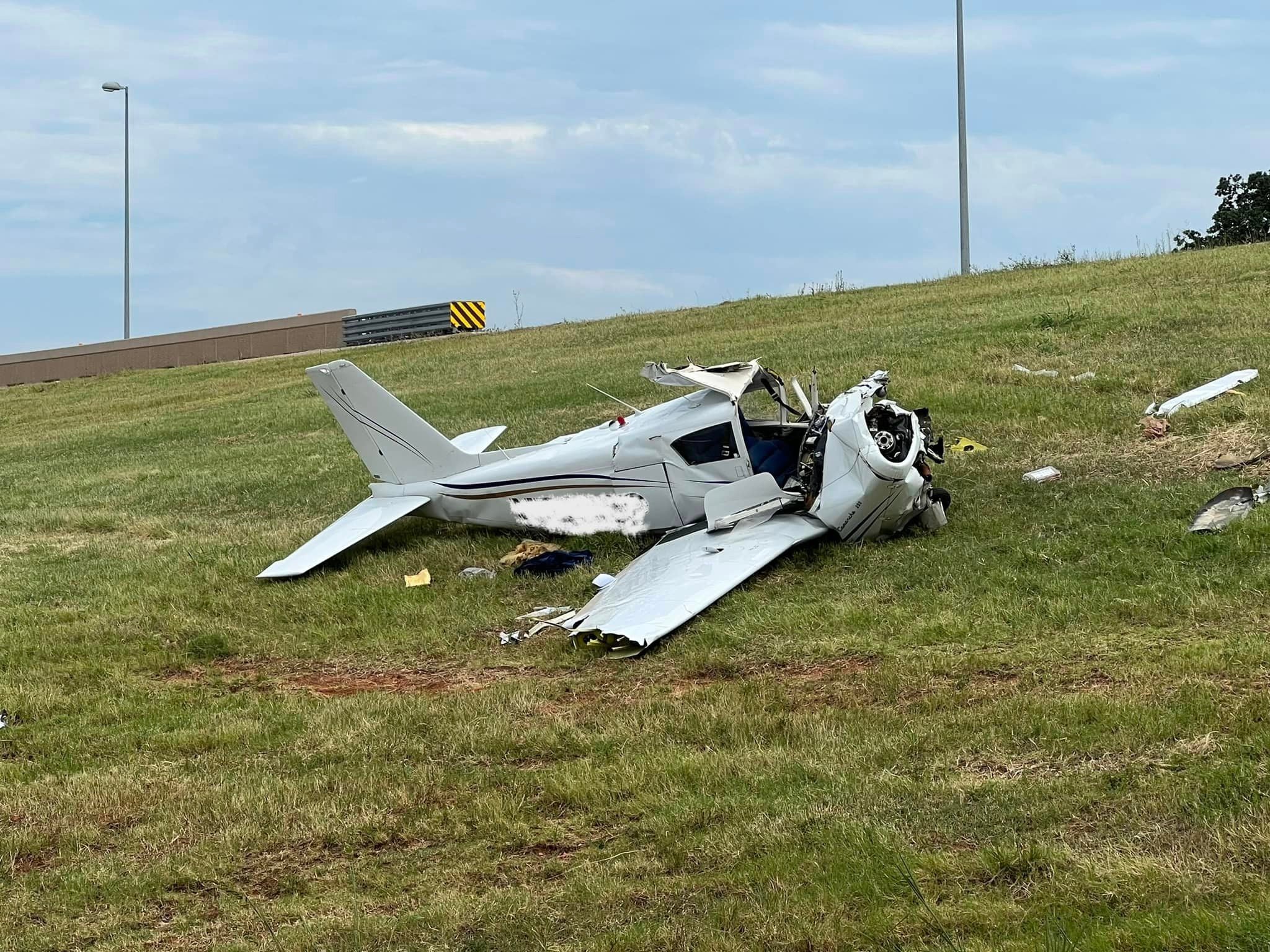 The pilot of a Piper plane may have been trying to make an emergency landing when he crashed near an Oklahoma interstate on Sunday, officials say
