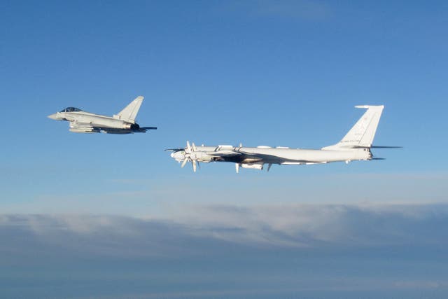 <p>RAF Typhoon (left) monitoring one of two Russian Tu-142 maritime reconnaissance and anti-submarine warfare aircraft</p>