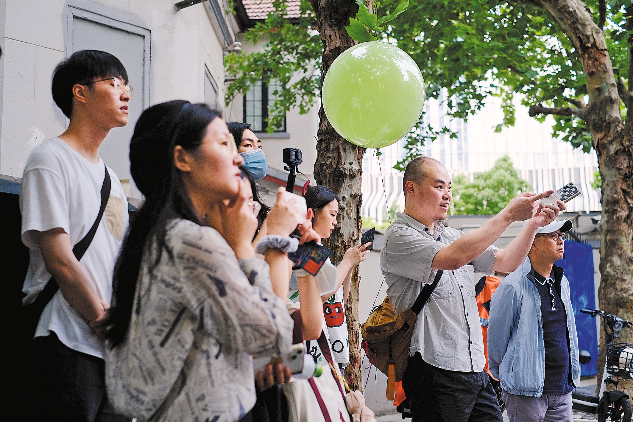 City walkers explore historical alleyways in Shanghai in late May, 2023