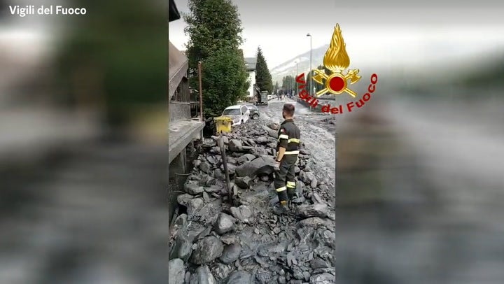 <p>Firefighters search for missing after landslide devastates Italian Alpine town.</p>
