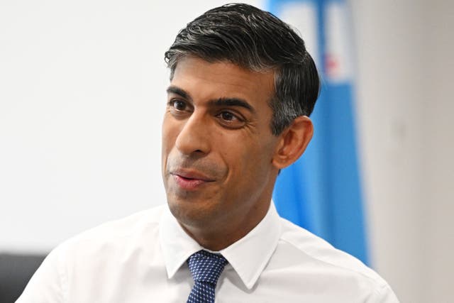 Prime Minister Rishi Sunak speaks to staff and patients in the same day emergency care unit during a visit to Milton Keynes University Hospital, Milton Keynes (Leon Neal/PA)