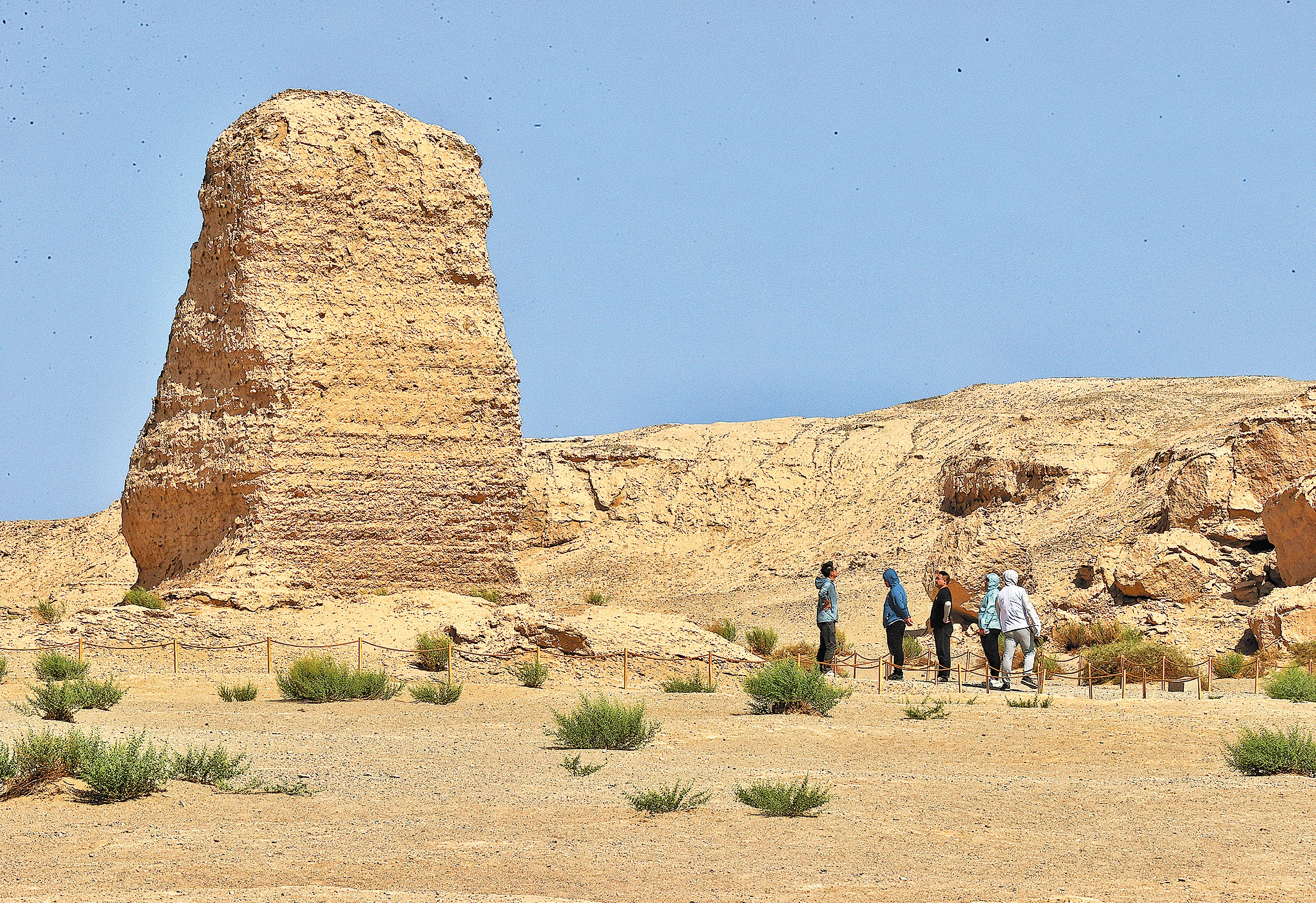 Visitors at the ruins of a beacon tower of the Han Dynasty (206 BC-220 AD) Great Wall in Dunhuang, Gansu province