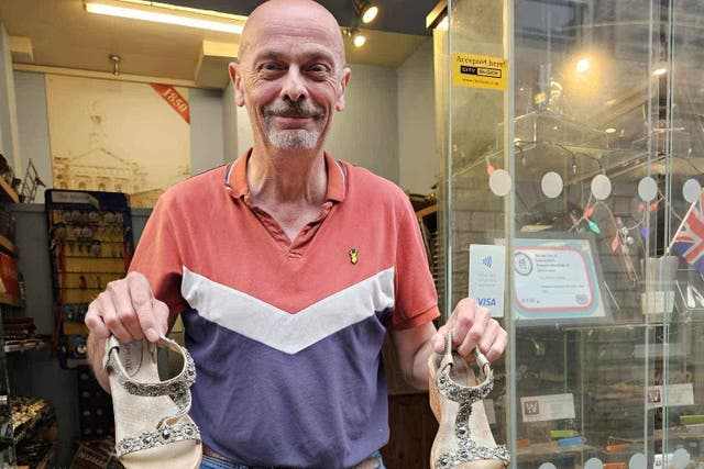 Peter Corke mended the broken shoes he found outside his shop (Peter Corke/PA)