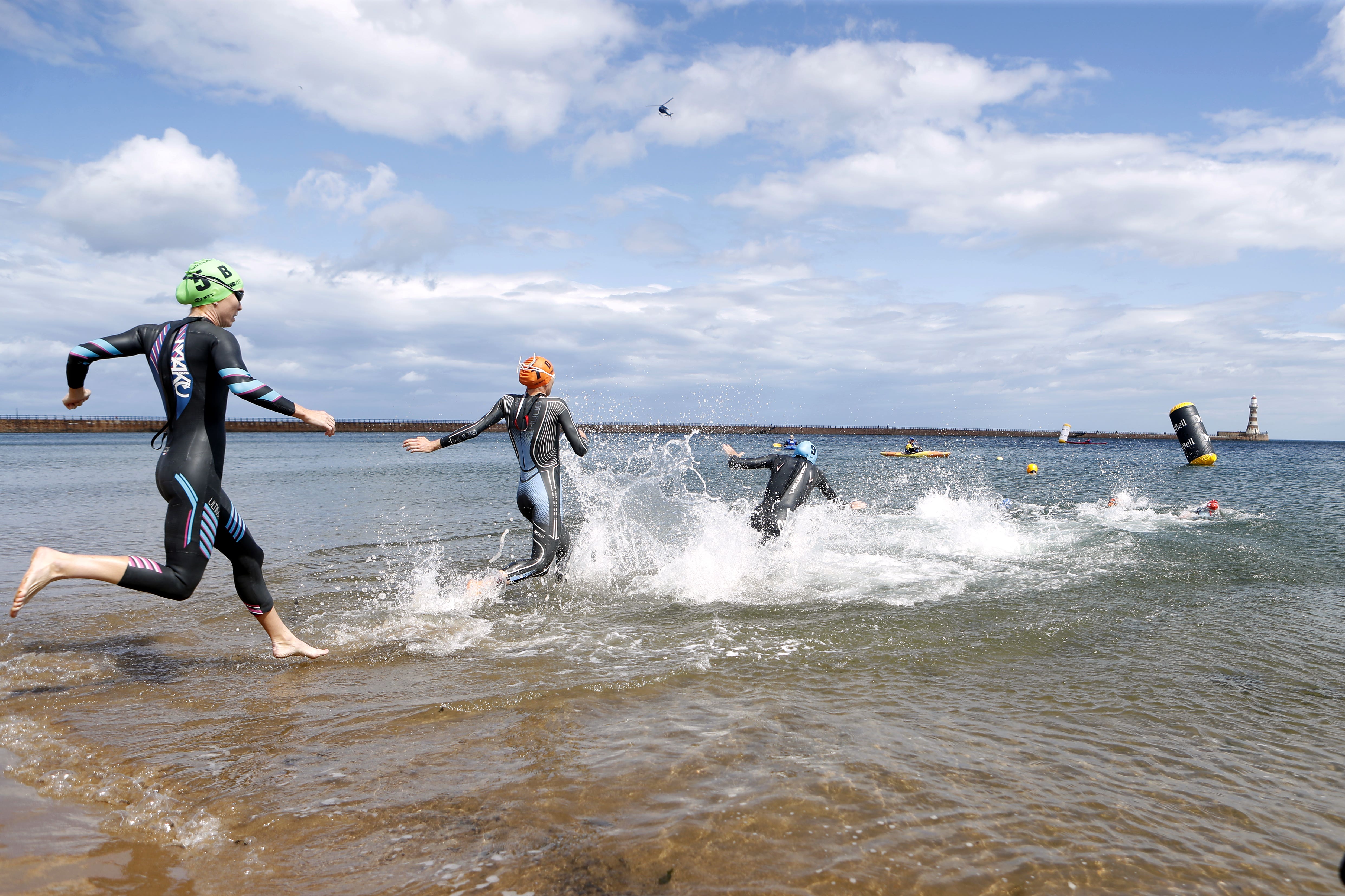 Triathletes at Roker Beach in Sunderland (Will Matthews/PA)