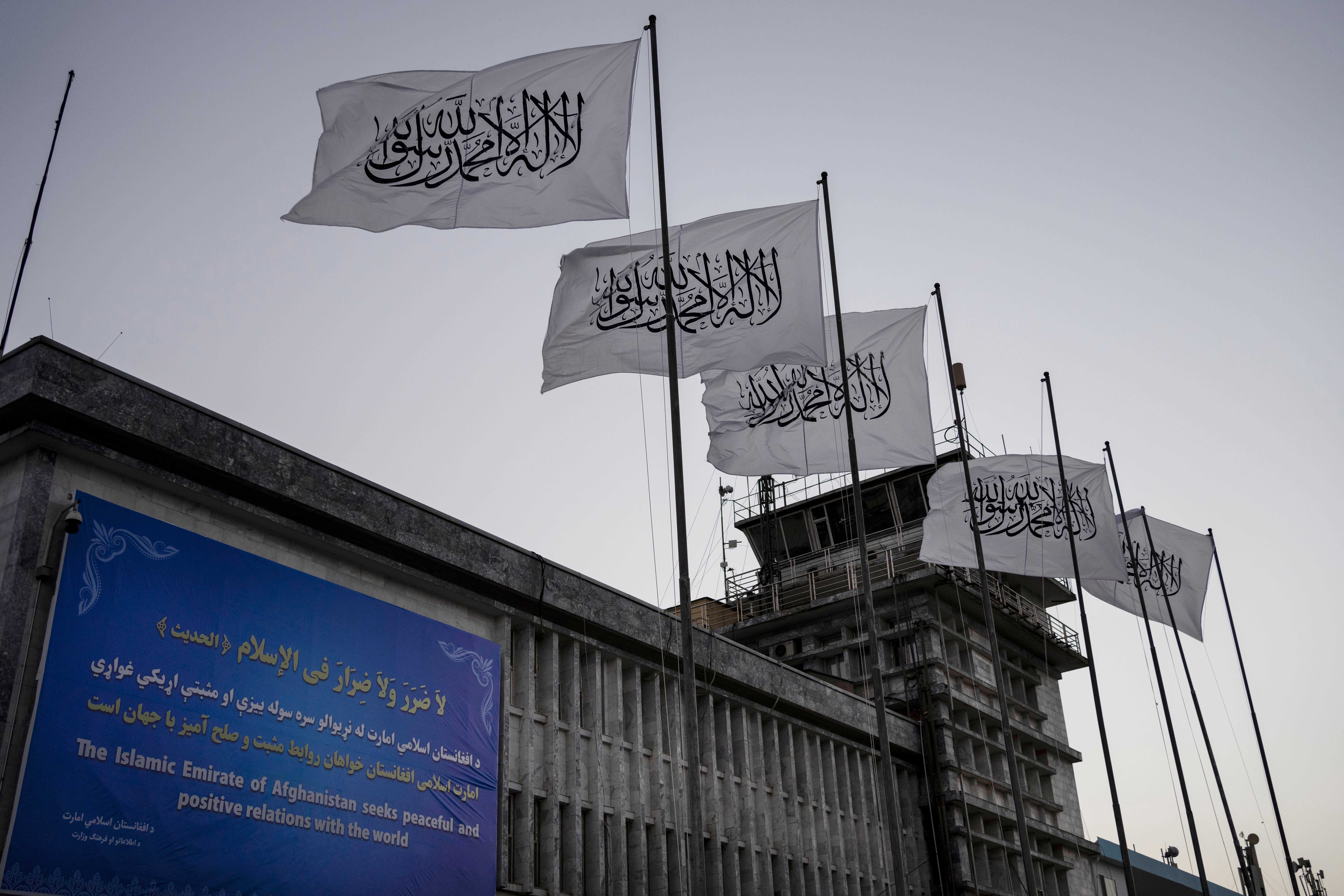 Taliban flags fly at the airport in Kabul, Afghanistan, in September 2021