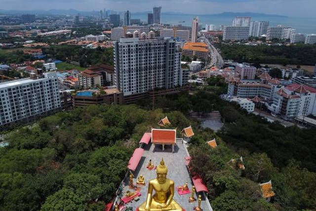 <p>This aerial photograph shows the 18-metre tall Big Buddha statue at the Wat Phra Yai Temple in Pattaya City</p>
