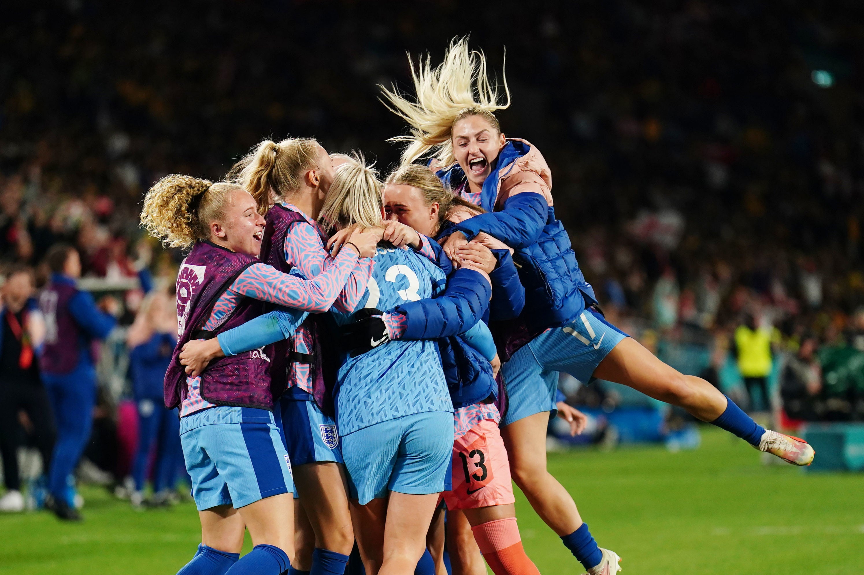 England players swamp Russo after her match-killing goal