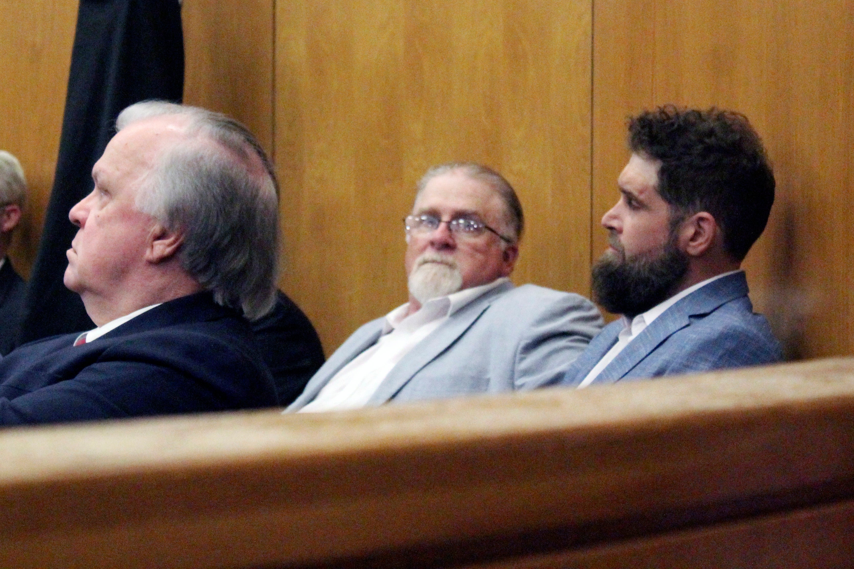 Gregory Case and Brandon Case (pictured second from right and right) at their trial earlier this month