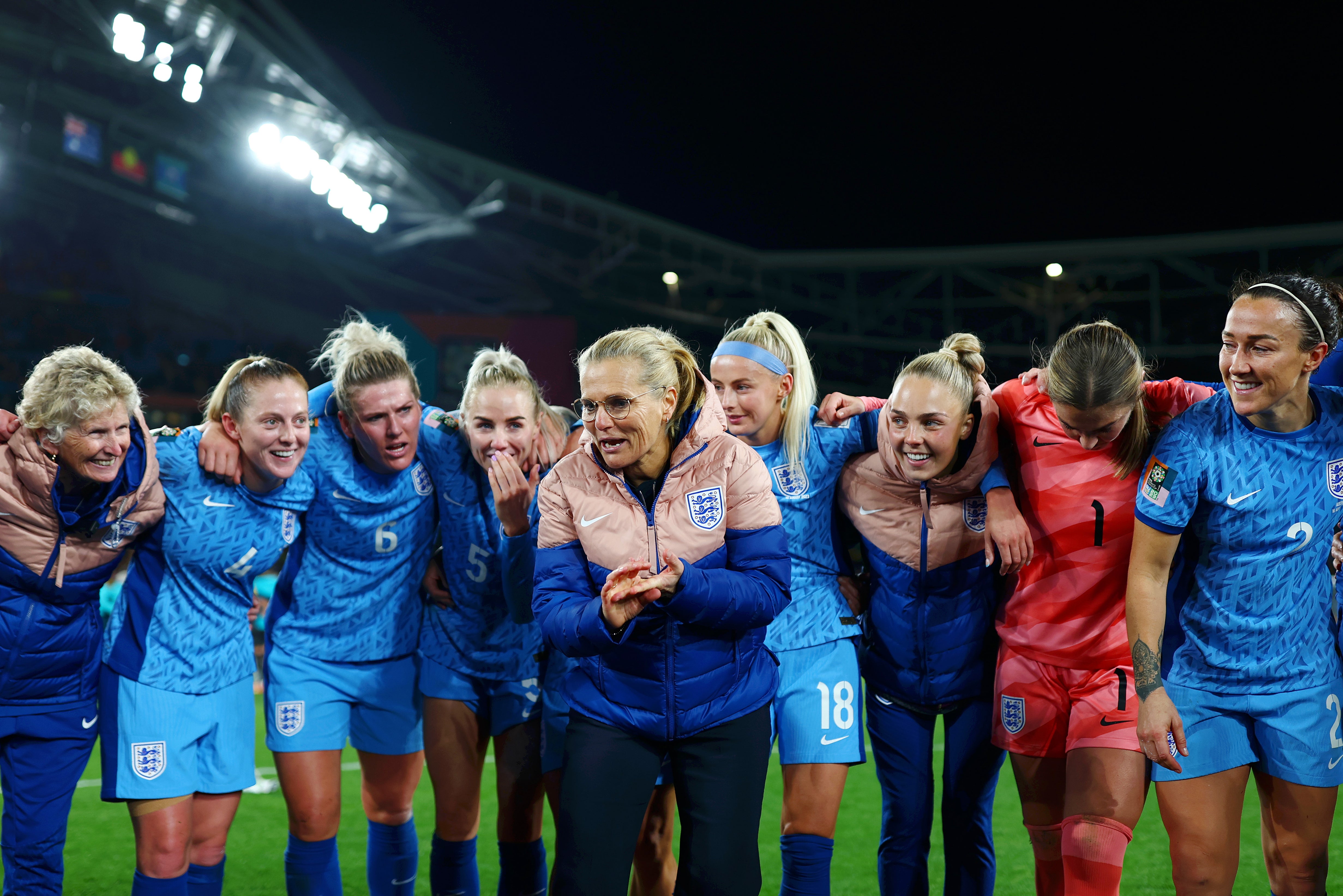 Sarina Wiegman, centre, with her players after England’s semi-final win over Australia